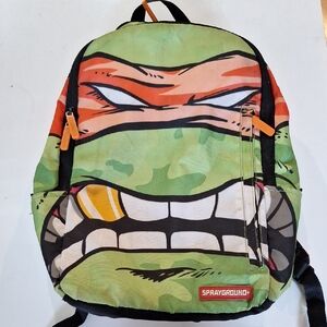 Sprayground Ninja Face Backpack - Green, Orange, Black Ninja Turtle